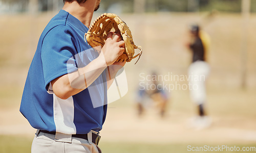 Image of Baseball, sports and pitcher with a ball and glove to throw or pitch at a match or training. Fitness, softball and man athlete playing a game or practicing pitching with equipment on outdoor field.