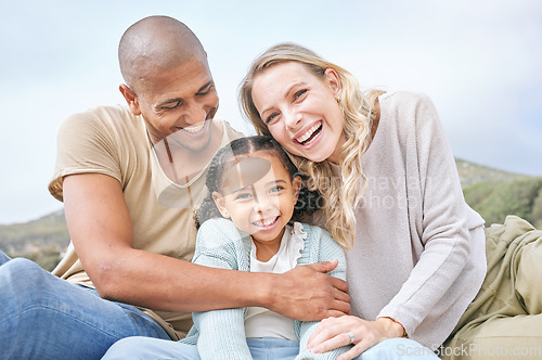 Image of Happy, family relax and portrait in nature on vacation, holiday or summer trip. Travel, diversity and father, mother and girl, bonding and care, spending quality time together and love with a smile.