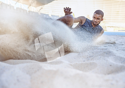 Image of Man, athlete and sand for long jump, sport and training for sports, field and global competition. Sport, motivation and goal for podium, winning and world record for jumping at arena, stadium or park