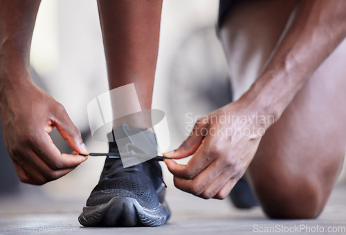 Image of Fitness, hands and sports man with running shoes for training, cardio exercise and workout outdoors. Footwear, zoom and athlete runner tie shoelaces getting ready for exercising for a marathon