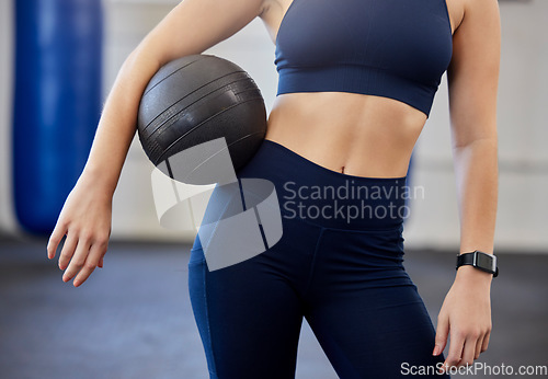 Image of Woman, fitness and medicine ball for exercise, workout or training in a gym for a healthy, wellness and strong body. Athlete with equipment or gear for cardio, weight exercising and in health club