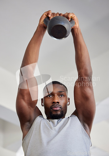 Image of Kettlebell, exercise and black man doing training, wellness and workout for fitness, health and strength in sportswear. Male athlete, strong trainer and healthy for cardio, focus and weight lifting.