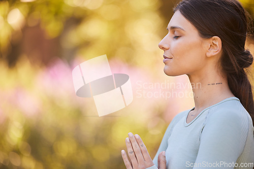 Image of Calm, meditation and woman doing yoga in park for peace, quiet and zen. Healthy lifestyle, relax and hands of girl together to mediate in nature. Motivation, wellness and mindful exercise in morning
