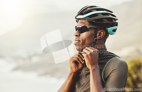 Image of Mountain, helmet and motorcycle black man in marathon, fitness or sports competition on sky mock up marketing and advertising. Adventure training african athlete with safety gear for outdoor cycling