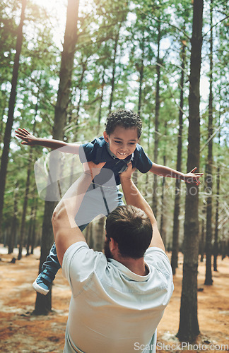 Image of Forest, adoption and love of father lifting son to play airplane wings or flying in air game. Foster, interracial and family with happy black kid bonding with caucasian dad in Canada nature.