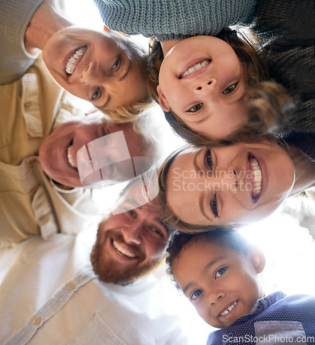 Image of Family, face and below huddle for support of grandparents, parents and children together with smile, happiness and love circle. Men, women and diversity kids hugging, smiling and happy about adoption