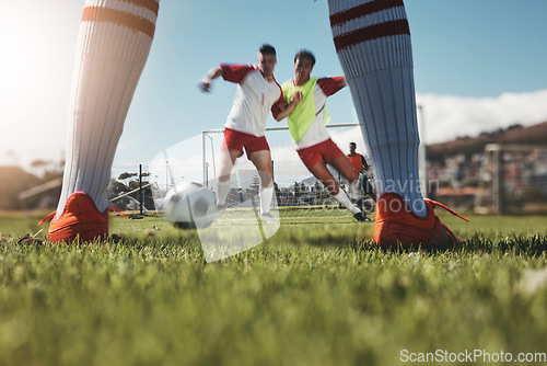 Image of Sports game, football field action and legs of soccer player in competition, fitness practice or cardio health workout. Competitive sport, exercise shoes and training man or athlete on grass pitch