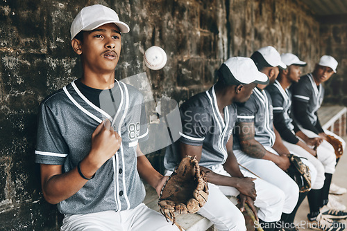 Image of Baseball, sports and team with a man athlete thinking about the match or game while sitting in the dugout. Exercise, fitness and idea with a male baseball player group ready to play in a match