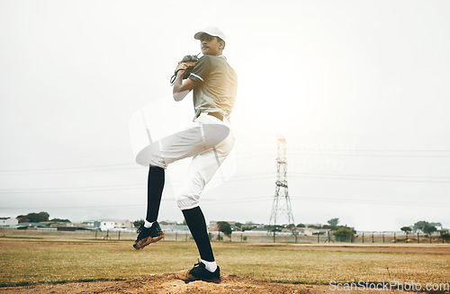 Image of Baseball player, pitch and sports athlete man outdoor on a field with focus and fitness. Game training, exercise and team workout of a strong person playing baseball ready for cardio and exercising