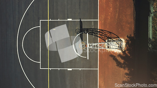 Image of Aerial background basketball court, sports playground and outdoor community turf for competition, training and ball game. Above basketball hoop, floor space lines and urban stadium pitch in sunshine