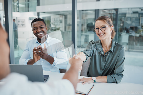 Image of Business people, handshake and interview in celebration for recruitment, hiring and employment at the office. Happy corporate executives congratulating new employee shaking hands for company growth