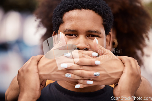 Image of Male silence, hands and protest in city for freedom, equality or justice in the community. Shame, victim and portrait of black man with covered mouth with fear, scared or pressure at public rally