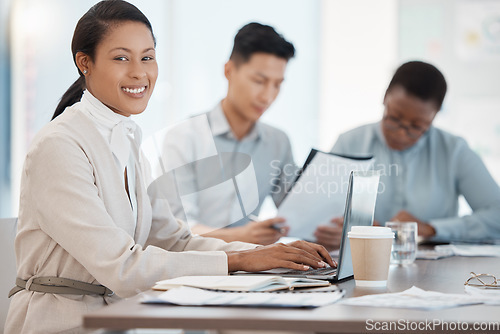 Image of Laptop, meeting and finance with a business woman and team in the boardroom for planning or strategy. Computer, accounting and teamwork with a female worker and employee group working in the office