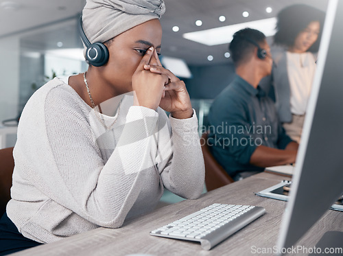 Image of Stress, call center and customer service with a woman consultant suffering from burnout or a headache. Contact us, telemarketing and mental health with a female crm employee at work in the office