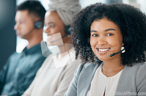 Image of Call center, customer service and telemarketing with a woman consultant and team working in the office. Crm, contact us and support with a female employee using a headset for help or consulting