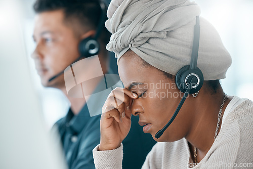 Image of Burnout, call center and customer service consultant with headache after long hours consulting, working and doing online support. Telemarketing, contact us and black woman with mental fatigue problem