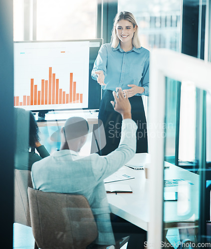 Image of Finance, meeting and presentation with a business woman answering a question in the boardroom. Teamwork , data and information with a female employee training or coaching her team in the office