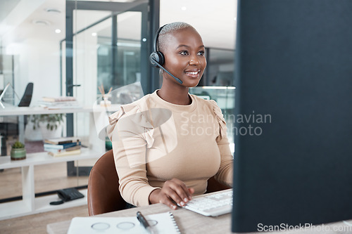 Image of Call center agent, black woman and consulting, support or advice with headset on computer. Contact us, consultant or telemarketing, customer service operator or worker from South Africa in office.