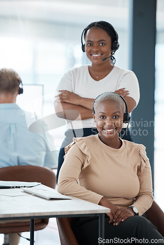 Image of Happy, black woman and call center team smile in contact us, customer service or telemarketing at the office. Portrait of African American professional female consulting agents in support management