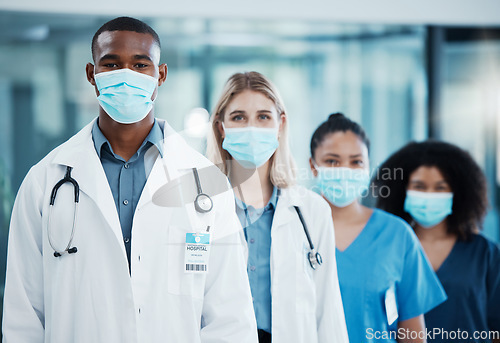 Image of Covid, medical doctors and team working in healthcare, consulting and in collaboration together at a hospital. Group of medicine workers with face mask for safety from virus in a row at a clinic