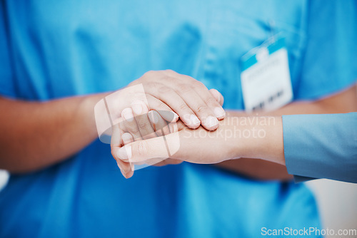 Image of Hospital nurse, patient support and hands held together with empathy, kindness and compassion. Nursing professional, healthcare wellness clinic and medical counseling a woman sorry for cancer results