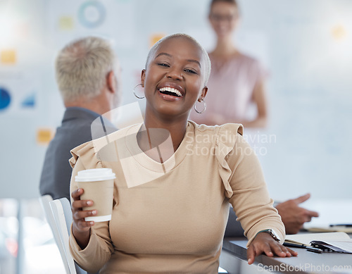 Image of Black woman, coffee and laughing office employee in a team meeting feeling happy about work. Portrait of a working bald worker from New York feeling happiness hearing a funny joke at advertising job