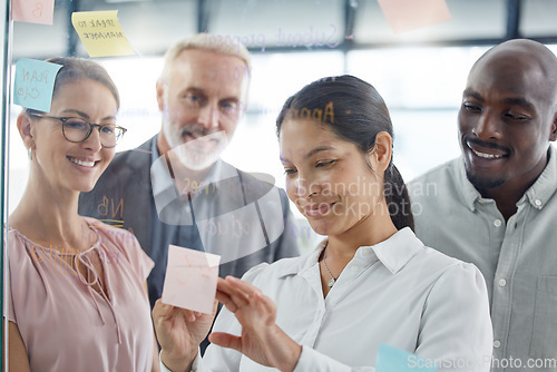 Image of Business people, meeting and schedule planning on sticky note for creative, strategy and vision idea sharing in office. Glass, wall and team collaboration on innovation, design and teamwork goal