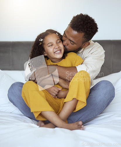 Image of Father, girl and family kiss with a hug on a bedroom bed spending quality time together. Morning, love and care of a dad and child in a home bonding and caring at a house with a happy smile