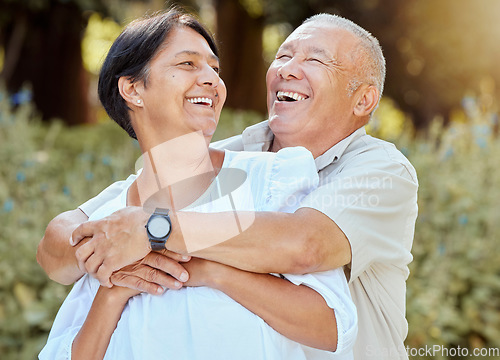 Image of Happy, couple and hug outdoor together with love, care and bonding while laughing. Marriage, retirement and quality time with happiness of senior people hugging in summer smile about life gratitude