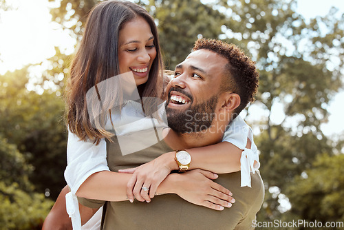 Image of Couple, piggy back and outdoor love hug of black people with happiness and care outdoor. Happy, gratitude and smile of a girlfriend and boyfriend bonding and spending quality time in a nature park