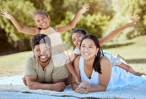 Image of Picnic park and family with children relax on blanket together for outdoor bonding, love and care with sunshine summer garden and trees. Nature, healthy and support parents with girl kids on ground