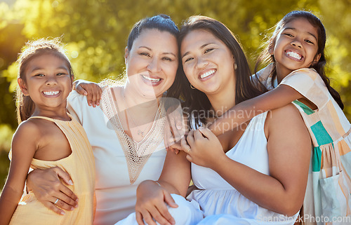 Image of Women, happy and nature park of a family together with a smile and hug bonding outdoor. Portrait of a mother, grandparent and girl siblings with happiness, love and care feeling positive in a garden