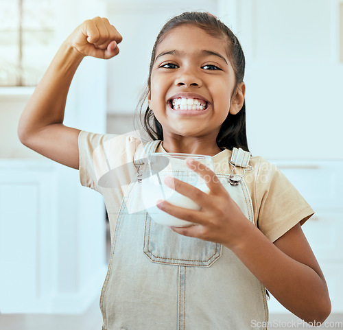 Image of Happy, health and milk by girl strong bone pose in living room, drinking milk for wellness, teeth and child development. Portrait, face and happy, proud and empowered child happy with breakfast drink