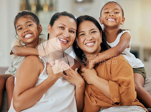 Image of Portrait of a grandmother, mother and girl children with a smile relaxing together in their home. Happiness, love and family from Mexico sitting on a sofa in the living room of their modern house.