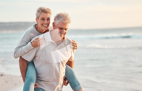 Image of Love, beach and piggyback with a senior couple walking by the sea or ocean while on a date in summer together. Nature, earth and water with an elderly man and woman pensioner taking a walk on a coast