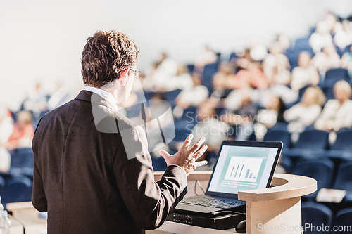 Image of Speaker at Business Conference and Presentation.