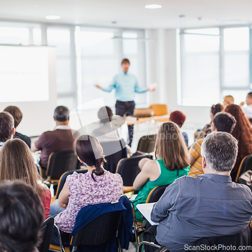 Image of Speaker giving presentation on business conference.