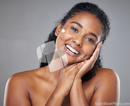 Image of Woman, skincare cream and face portrait, sunscreen makeup product and luxury beauty cosmetics for wellness on studio background. Happy indian model, facial spf lotion or natural aesthetic dermatology