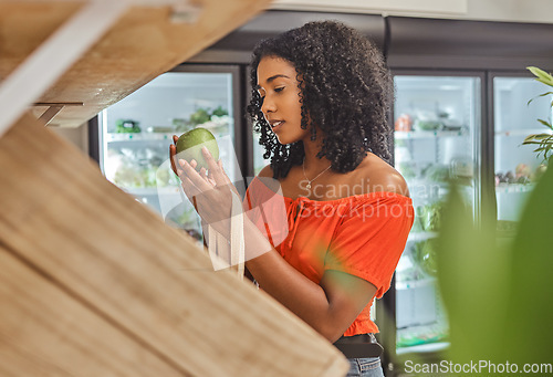 Image of Shopping, avocado and fruit at supermarket shop, buying healthy food and purchase item at a grocery store. Woman deciding, choosing and picking, fresh and delicious produce at organic farmers market