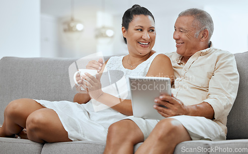 Image of Love, senior couple and tablet to scroll online, being happy and smile together on living room sofa. Romance, man and woman with digital device for bonding, anniversary and marriage or relax on couch