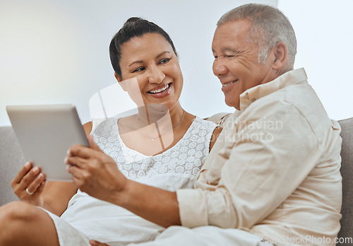 Image of Love, senior couple and tablet being happy, smile and relax together on living room couch. Romantic, man and woman with digital device for bonding, anniversary and marriage or scroll online on sofa.