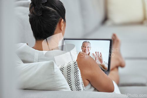 Image of Senior, woman and tablet for video call on sofa with man, husband or friend on internet in home. Couple, couch and video conference in living room with happy, boyfriend or spouse on screen in house