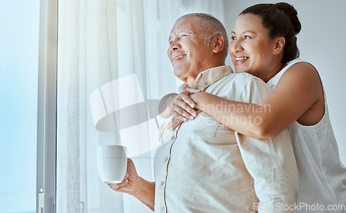 Image of Senior couple, retirement future and window vision for thinking, love and care in Colombia home. Happy, elderly and thinking woman hug man in house of morning relax, wellness hope and lifestyle peace