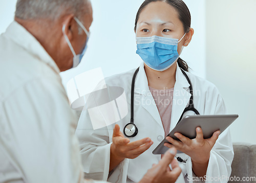 Image of Covid doctor, tablet and talking to patient for medical check, wellness consult and healthcare advice in clinic. Therapist, face mask and corona virus consulting, insurance and test results feedback