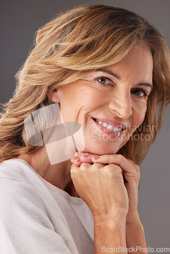 Image of Mature woman, portrait of senior health and natural skincare beauty with antiaging happiness with a smile. Middle aged face, lady smiling and organic cosmetic spa treatment on gray studio background