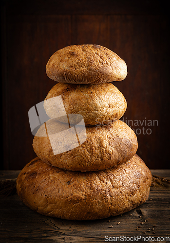 Image of Four bread arranged in a pyramid formation