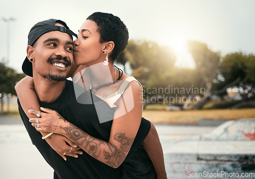 Image of Black couple, hug and cheek kiss in city, affection or bonding together with smile. Love, romance and happy man and woman enjoying quality time together outdoors in urban town, having fun and kissing