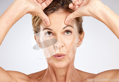 Image of Senior woman, beauty portrait and face lift on gray studio background. Wellness, skincare model and lady from Canada with spa aesthetic for skin anti aging, cosmetics or healthy facial care treatment.