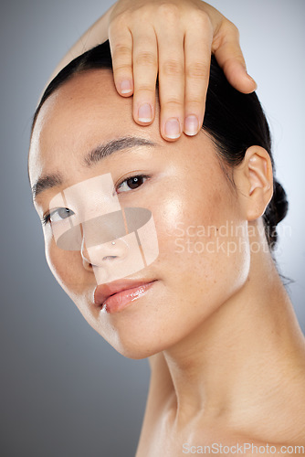 Image of Beauty, asian woman and skincare, wellness and aesthetic cosmetics, self care and glowing skin on studio background. Portrait Japanese female model, collagen face filler and natural body dermatology