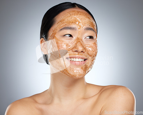 Image of Exfoliate face mask for beauty skincare, natural product for healthy skin and clean cosmetic wellness for body against grey mockup studio background. Happy, smile and healthcare on Asian woman model